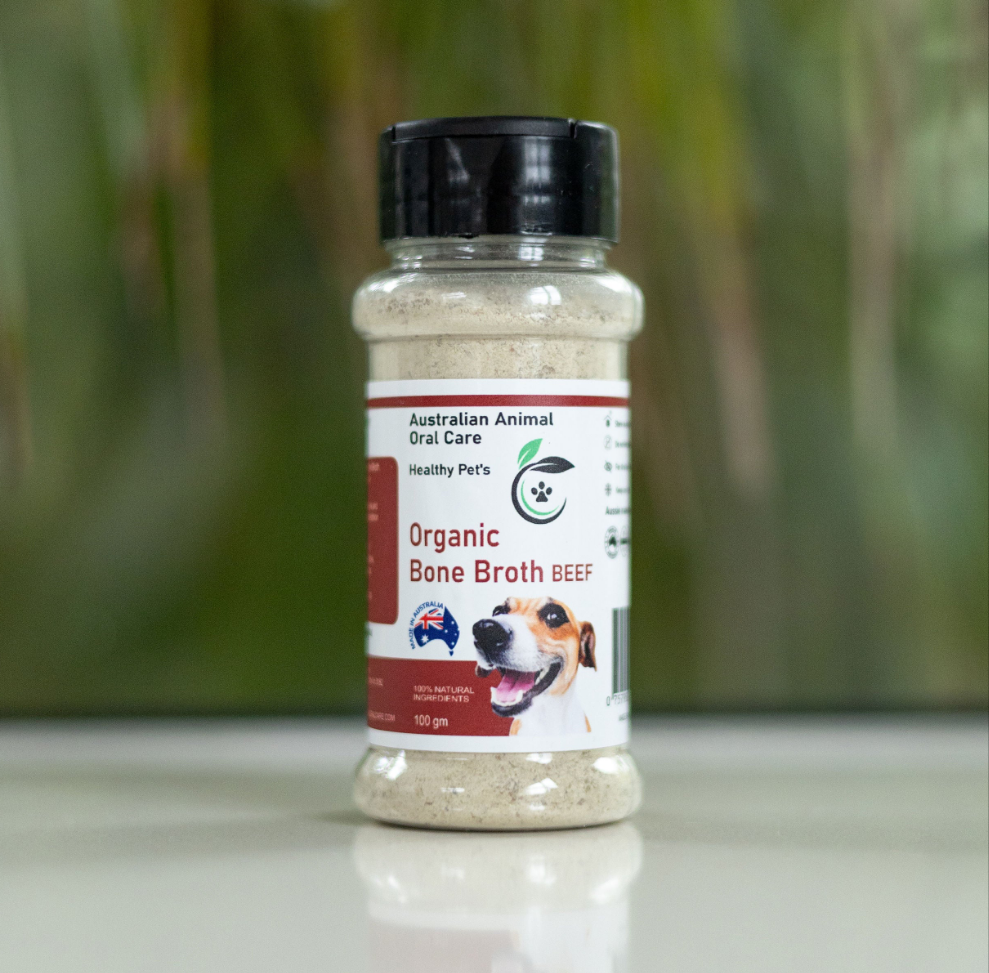 Bottle of Organic Bone Broth Beef on a white surface with a blurred green background